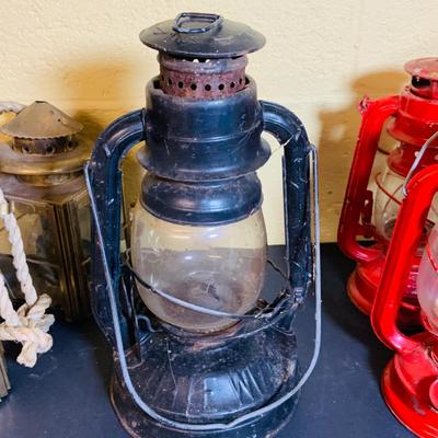 LOT 370: Collection of Oil Burning Lamps/Lanterns Including a Two Ship’s Lamps and Rail Road Lanterns