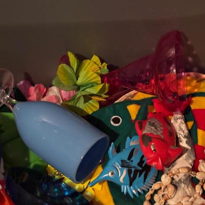 LOT 377: Luau Decor and More: Hula Hoops, Color Felt Fish Hats. Seashells, Child Size Hula Skirts and More