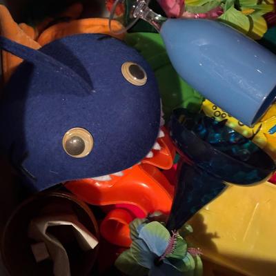 LOT 377: Luau Decor and More: Hula Hoops, Color Felt Fish Hats. Seashells, Child Size Hula Skirts and More
