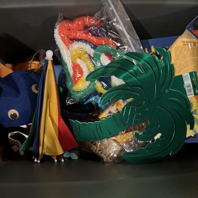 LOT 377: Luau Decor and More: Hula Hoops, Color Felt Fish Hats. Seashells, Child Size Hula Skirts and More