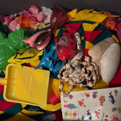 LOT 377: Luau Decor and More: Hula Hoops, Color Felt Fish Hats. Seashells, Child Size Hula Skirts and More