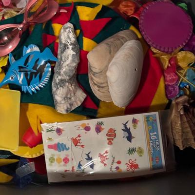 LOT 377: Luau Decor and More: Hula Hoops, Color Felt Fish Hats. Seashells, Child Size Hula Skirts and More