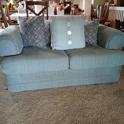 Teal Upholstered Loveseat with Accent Pillows