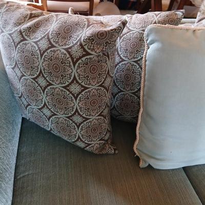 Teal Upholstered Loveseat with Accent Pillows