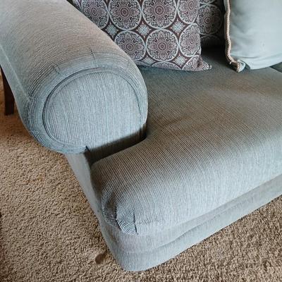 Teal Upholstered Loveseat with Accent Pillows