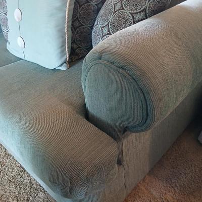 Teal Upholstered Loveseat with Accent Pillows