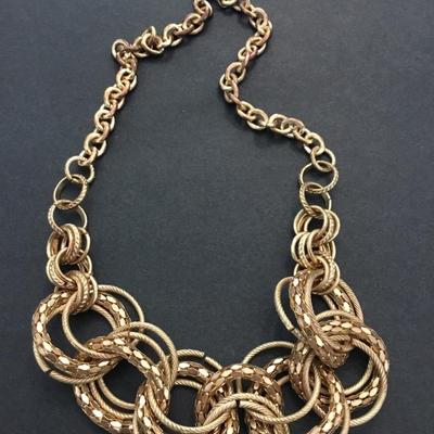 Gold toned large gold whooped statement necklace chain has some wear