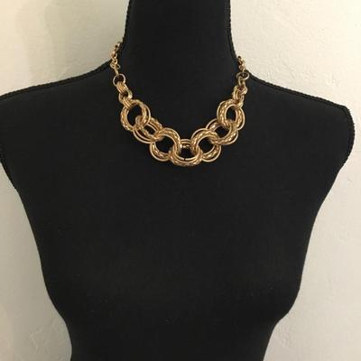 Gold toned large gold whooped statement necklace chain has some wear