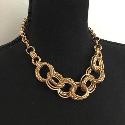 Gold toned large gold whooped statement necklace chain has some wear