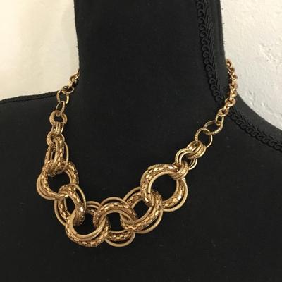 Gold toned large gold whooped statement necklace chain has some wear