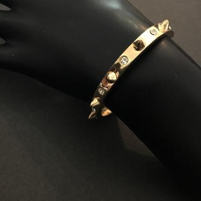 Very nice gold toned, rhinestone spike cuff bracelet