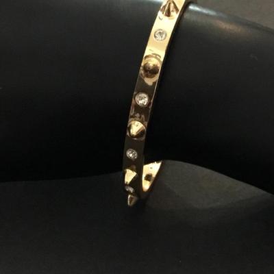 Very nice gold toned, rhinestone spike cuff bracelet