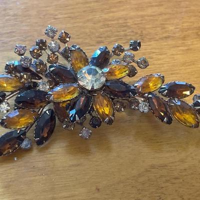 Heavy stone brooches