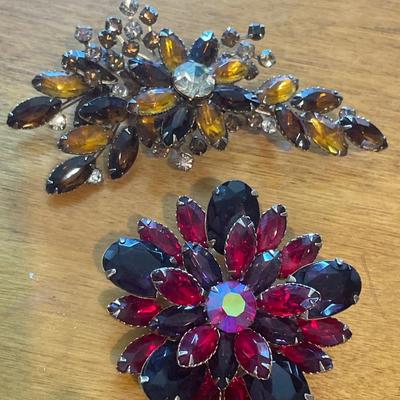Heavy stone brooches
