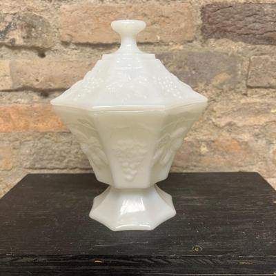 Sale Photo Thumbnail #348: Excellent Fenton milk glass hobnail milk glass basket, Anchor Hocking milk glass paneled covered candy dish, pair of vintage brass deer, and pair of Thomas Kincade canisters
