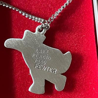 Sale Photo Thumbnail #64: Olympic collectible pendant pewter 
Engraved 1980