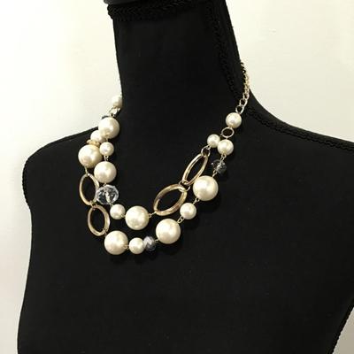 Chunky gold, toned bow, pearl, faceted, glass beaded necklace