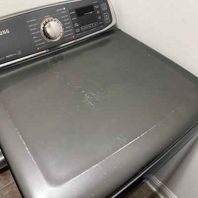 Sale Photo Thumbnail #305: Samsung Electric Dryer, Model DV52J8700EP/A. 

This dryer is in good working condition—see photos of of surface scratches or any wear.