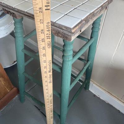 Tile top table with vintage bird decor