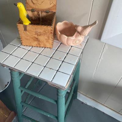Tile top table with vintage bird decor