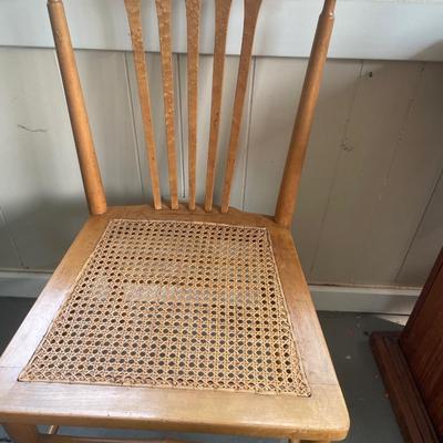 Chair with rabbit crossing sign and basket