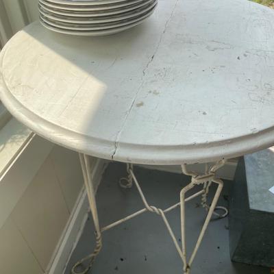 Vintage round table with metal legs