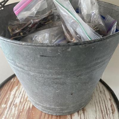 Bucket of vintage handles and hooks