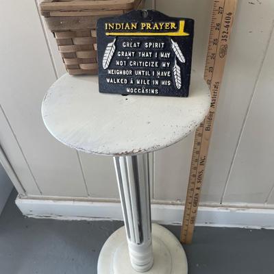 Vintage pedestal table with Indian prayer and small basket