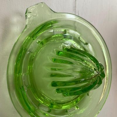 Green glass juicer and flower frog