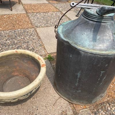 Pottery bowl with vintage gas can