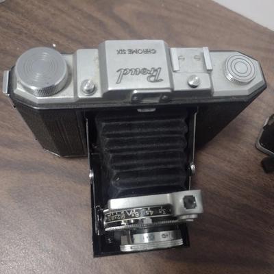 Set of Three Vintage Cameras Include Proud Chrome Six, Yoshi Pro Shot and a Revere 8mm