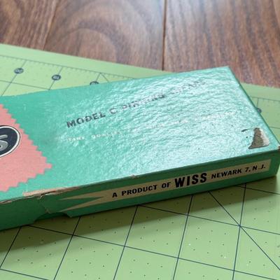LOT 152L: Fiskars 24 x 6 inch Acrylic Ruler, Fiskars 24 x 18 inch Cutting Mat, XL Watercolor Paper Pad & Vintage Wiss Model C Pinking...