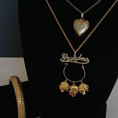 Vintage Gold-Tone Jewelry Lot – Heart Locket, “Grandma” Charm Necklace, and Textured Cuff Bracelet