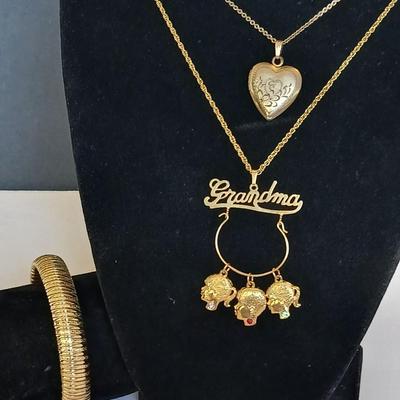 Vintage Gold-Tone Jewelry Lot – Heart Locket, “Grandma” Charm Necklace, and Textured Cuff Bracelet