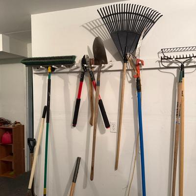 Sale Photo Thumbnail #34: Tidy up your yard or tackle your next landscaping project with this quality collection of long-handle garden tools. All tools are in good used condition and ready for immediate use.

Includes:

2 large garden rakes (one plastic leaf rake, one metal bow ra