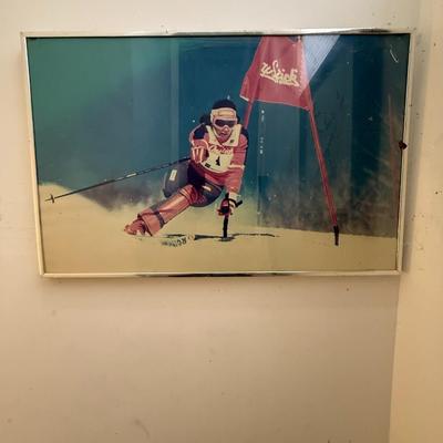 Sale Photo Thumbnail #40: Striking vintage ski racing photo print capturing a skier mid-turn at high speed, with the classic Klöck flag prominently featured. This high-energy shot embodies the intensity of slalom racing and would make an excellent addition to any ski lodge, sport