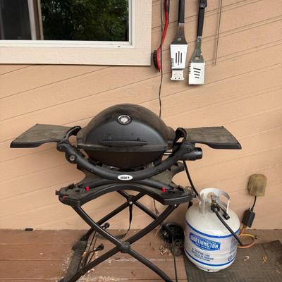 Sale Photo Thumbnail #42: Weber Q Portable Gas Grill with Rolling Cart + Propane Tank & Tools ?
Take your backyard BBQs or tailgates to the next level with this Weber Q gas grill, mounted on a rolling stand with fold-out side tables. Includes a full-size Worthington propane tank a