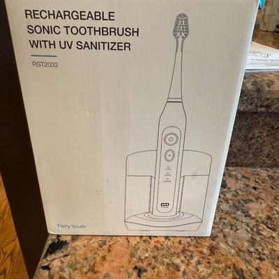 Sale Photo Thumbnail #61: Upgrade your dental care with this Fiery Youth rechargeable toothbrush featuring sonic cleaning technology and a built-in UV sanitizer to keep brush heads bacteria-free.

Features:

Sonic brushing action

Charging base with UV sanitizer

Multiple brushing