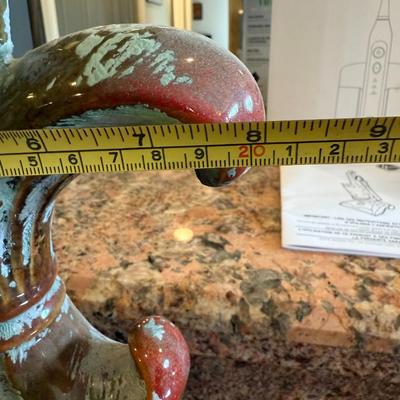 Sale Photo Thumbnail #64: Add a touch of French charm to your home or garden with this distressed fleur-de-lis finial. Heavy cast resin with worn red and sage green finish gives it a rustic, vintage look.

Details:

Approx. 10–12" tall

Beautiful ornate base

Great as a shelf ac
