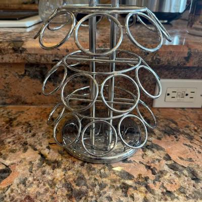 Sale Photo Thumbnail #66: Sleek and space-saving, this rotating chrome K-Cup holder keeps up to 24 pods organized and easily accessible. Smooth spinning base makes choosing your morning brew a breeze.