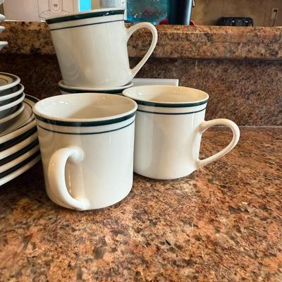 Sale Photo Thumbnail #84: lassic white ceramic dishes with a blue rim. Includes dinner plates and shallow bowls—great for everyday use or adding to an existing set
