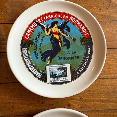 Sale Photo Thumbnail #90: Charming vintage-style appetizer or dessert plates featuring colorful French Camembert cheese label art. Ideal for entertaining, charcuterie boards, or farmhouse décor.