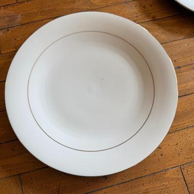 Sale Photo Thumbnail #96: Timeless and refined, this 1995 “Classic Elegance” fine china set by The Cellar includes dinner plates, salad plates, bowls, cups, a teapot, creamer, sugar bowl, and serving pieces. White with a thin gold rim, perfect for formal dining or holiday gath