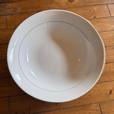 Sale Photo Thumbnail #101: Timeless and refined, this 1995 “Classic Elegance” fine china set by The Cellar includes dinner plates, salad plates, bowls, cups, a teapot, creamer, sugar bowl, and serving pieces. White with a thin gold rim, perfect for formal dining or holiday gath