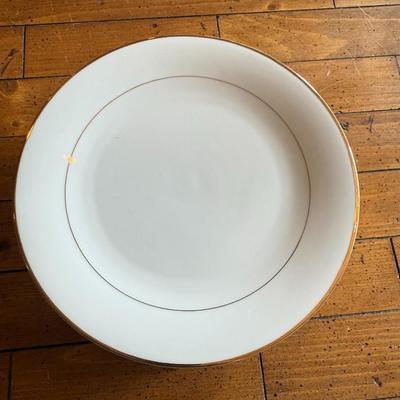 Sale Photo Thumbnail #114: Timeless and refined, this 1995 “Classic Elegance” fine china set by The Cellar includes dinner plates, salad plates, bowls, cups, a teapot, creamer, sugar bowl, and serving pieces. White with a thin gold rim, perfect for formal dining or holiday gath
