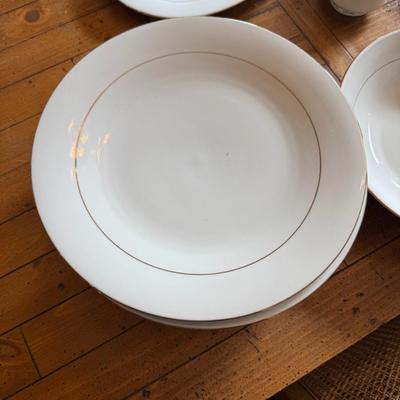 Sale Photo Thumbnail #100: Timeless and refined, this 1995 “Classic Elegance” fine china set by The Cellar includes dinner plates, salad plates, bowls, cups, a teapot, creamer, sugar bowl, and serving pieces. White with a thin gold rim, perfect for formal dining or holiday gath