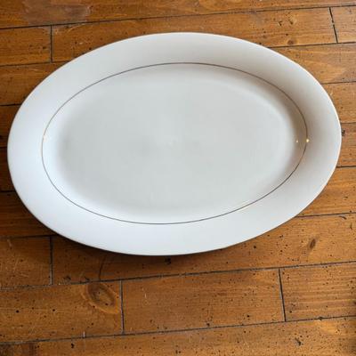 Sale Photo Thumbnail #116: Timeless and refined, this 1995 “Classic Elegance” fine china set by The Cellar includes dinner plates, salad plates, bowls, cups, a teapot, creamer, sugar bowl, and serving pieces. White with a thin gold rim, perfect for formal dining or holiday gath
