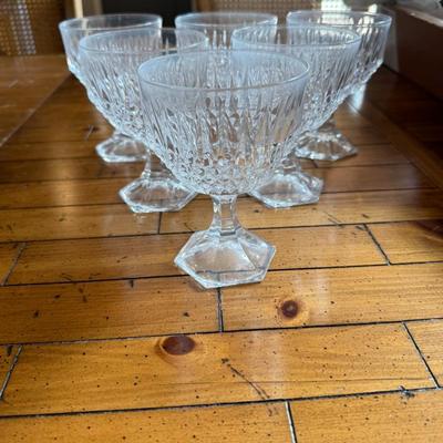 Sale Photo Thumbnail #120: Classic footed sherbet glasses with faceted stems and cut glass detailing. Ideal for serving desserts or fruit compote.