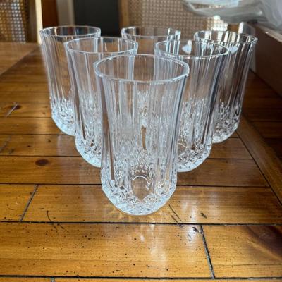 Sale Photo Thumbnail #123: Stylish vertical-ribbed tall glasses with crystal-cut detailing at the base. A timeless addition to any table.