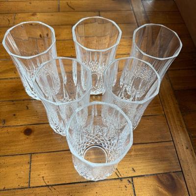 Sale Photo Thumbnail #124: Stylish vertical-ribbed tall glasses with crystal-cut detailing at the base. A timeless addition to any table.